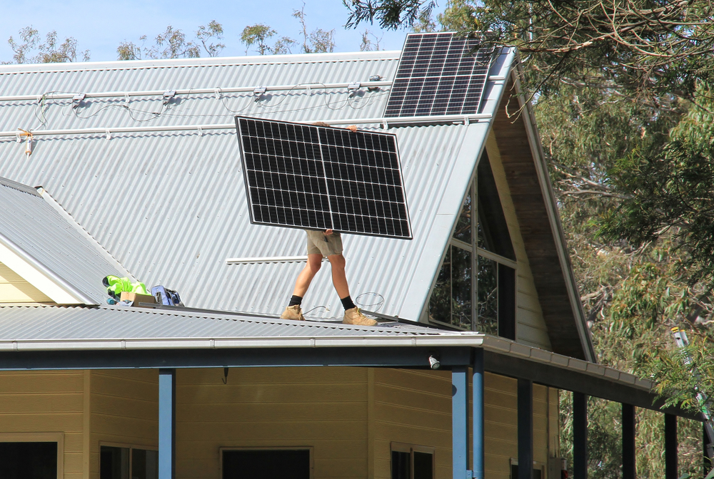 Solar Panel Being Carried - Solar Power Systems in Whitsundays QLD