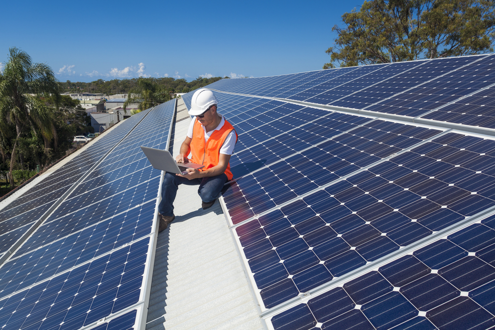 Solar Panel Technician On Roof - Solar Power Systems in Whitsundays QLD