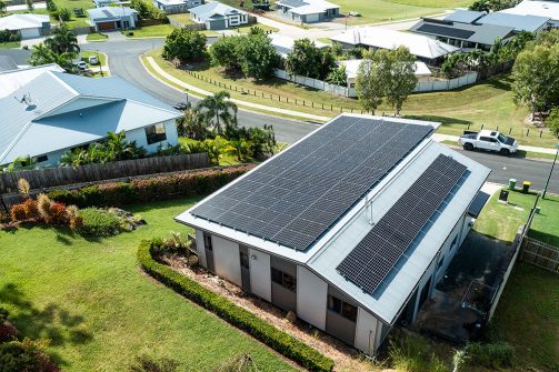 Aerial view of a house with solar panel on the roof — Solar Power Systems in Proserpine, QLD